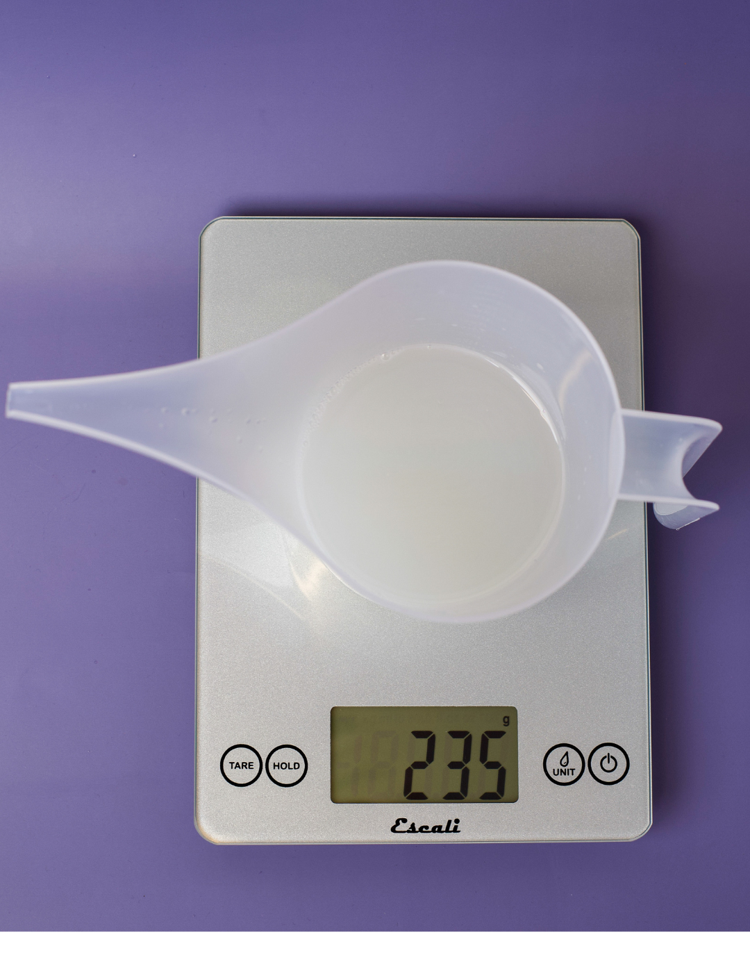 Final weight of solution on a scale.